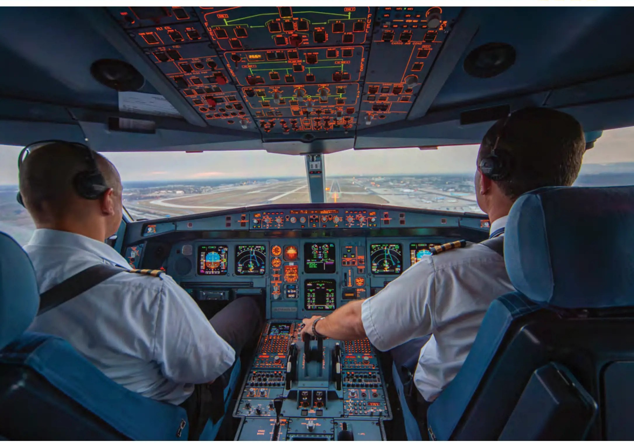 Two pilots in the cockpit on approach to landing